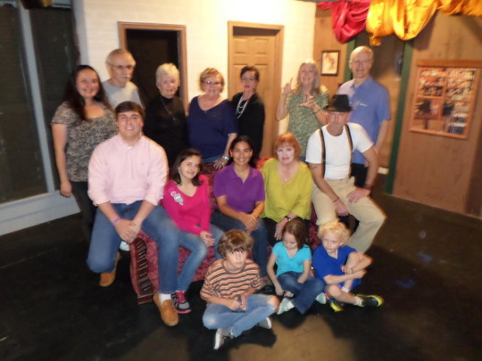 Actors in rehearsal for the Bay St. Louis Little Theatre's upcoming show "The Rose Tattoo." Seated on stage L to R: Jay Kelton, Leena Morgan, and Paul Fraiser. Second row seated: Ronnie Aleman, Amaya Clark, Rosa Obregon, Linda Aiaviolasiti, and Douglas Hadley. Standing L to R: Sarah Morgan, Terry Cullen, Linda Allen, Gloria Noonan, Melissa Kelton, Elizabeth Silverhawke, and Jim Fraiser