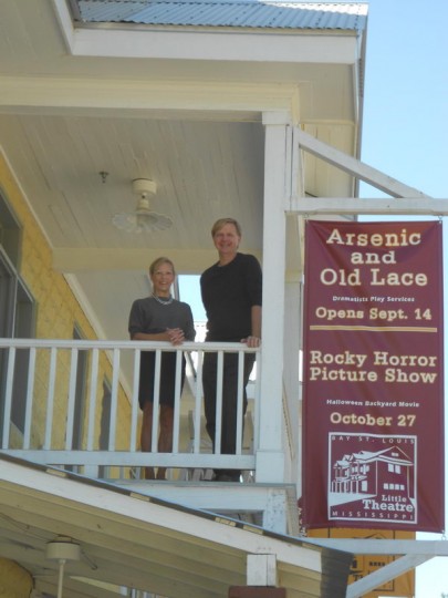 Little Theatre President, Cheryl Grace,and Vice-President, John Anderson, standing on the balcony of the Bay St. Louis Little Theatre, the winner of the 2013 Governor's Award for Arts in Excellence by the Mississippi Arts Commission.